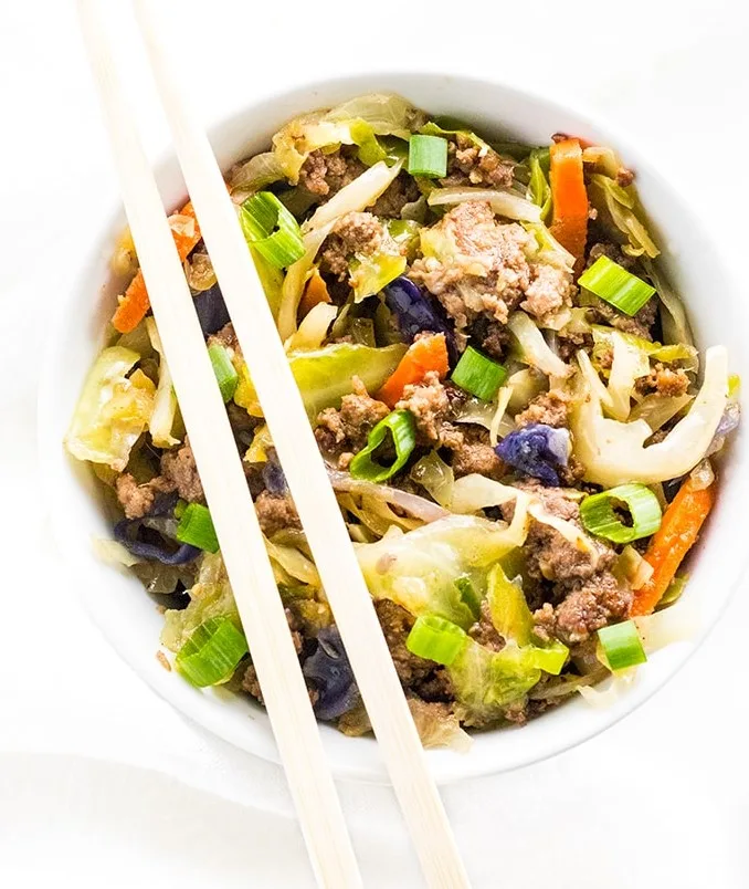 A high-protein bowl of ground meat, cabbage, carrots and scallions